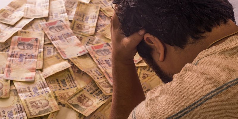 indian cash rupee ban man head in hands wide