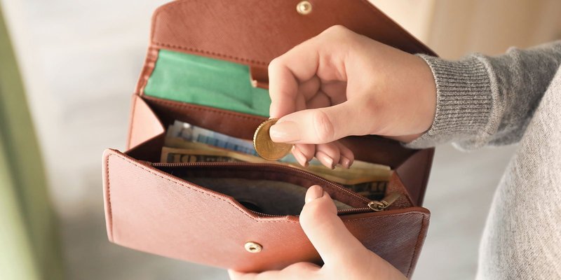 hands-wallet-shutterstock_1071701540.original