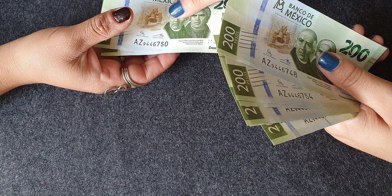 mexican-pesos-hands-HEADER-shutterstock-1515424.original