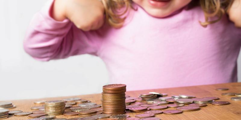 pink-girl-coins-HEADER-shutterstock-1542315755.original